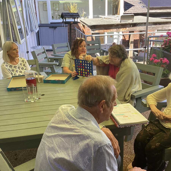 Older Clients Playing Games Outside