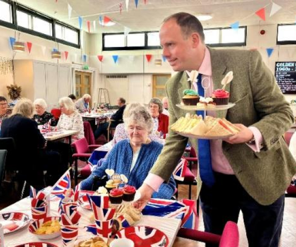 Greg Smith serving food