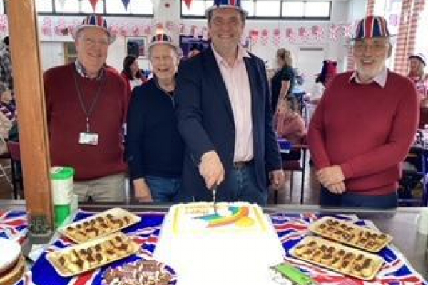 Trustees cutting the cake